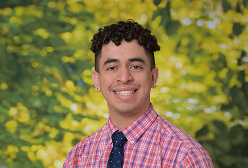 A picture of Oscar Puente outside and smiling for the camera.